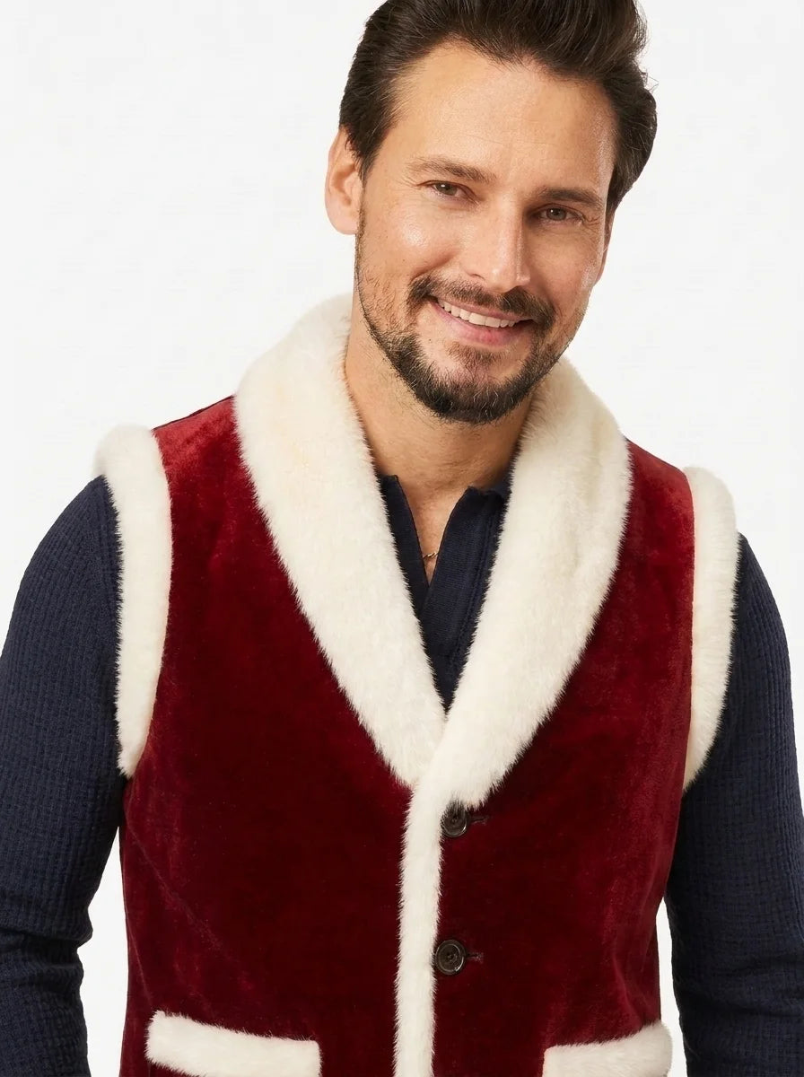 Close-up of red suede texture and white faux fur trim on a Christmas vest