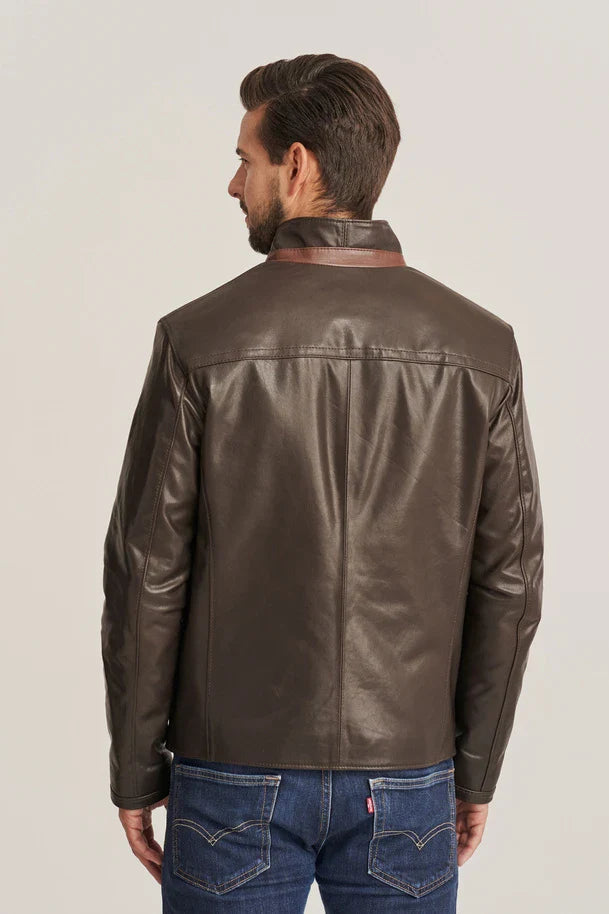 Man wearing a brown leather jacket on a plain background