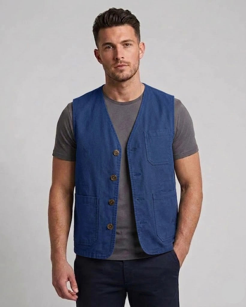 Men's royal blue cotton utility vest with front patch pockets and tailored fit, shown in front, side, and back view