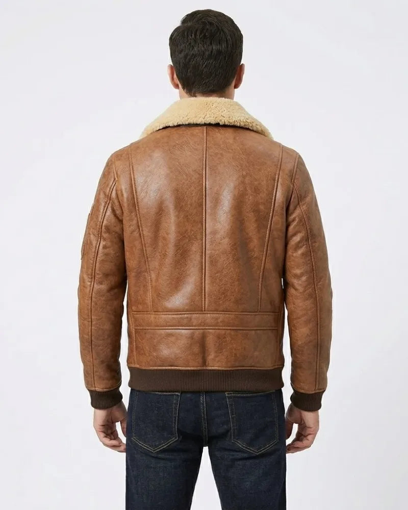 Brown leather jacket with shearling collar worn by a person on a white background