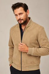 Men’s camel brown suede bomber jacket with a rib-knit stand collar, front zipper and matching ribbed cuffs.