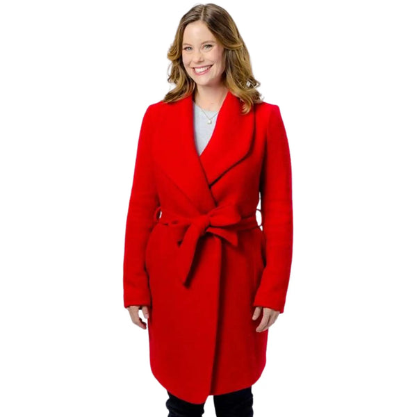 Woman wearing a red coat on a white background