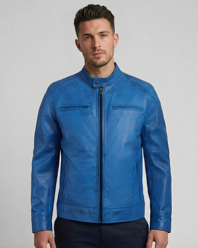 Man wearing a blue leather jacket on a gray background