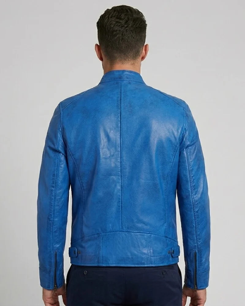 Blue leather jacket worn by a person on a plain background