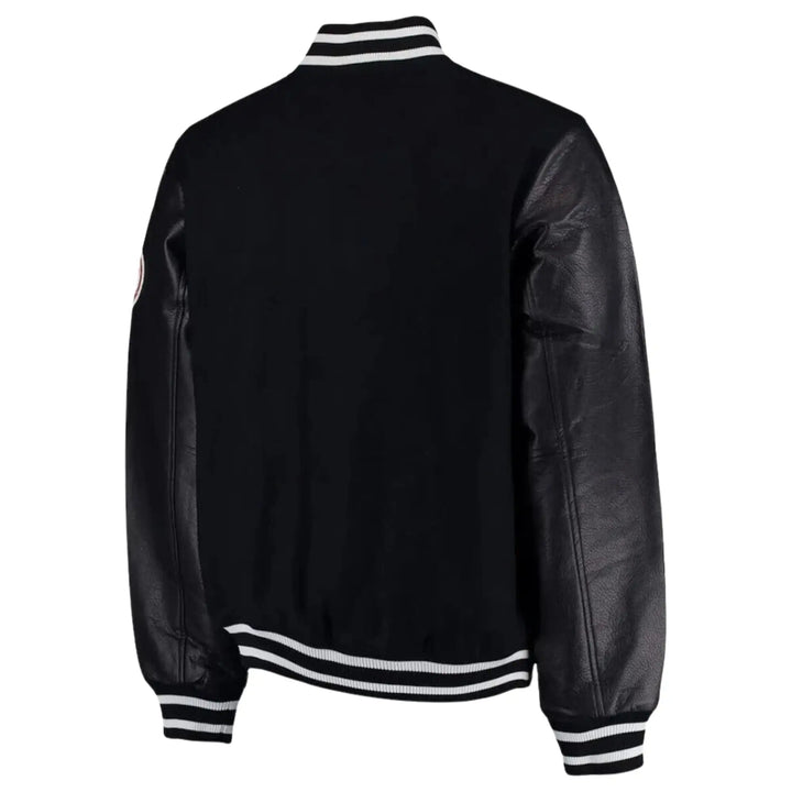 Black leather jacket with white and black striped trim on a white background