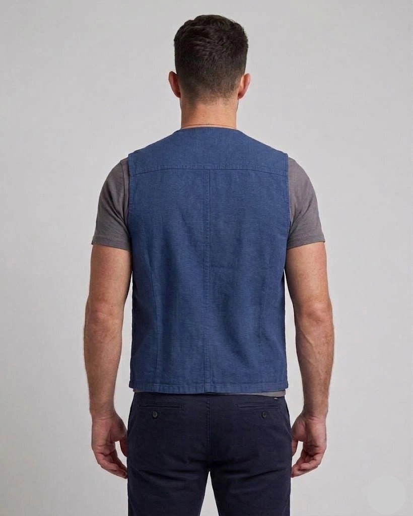 Men's royal blue cotton utility vest with front patch pockets and tailored fit, shown in front, side, and back view